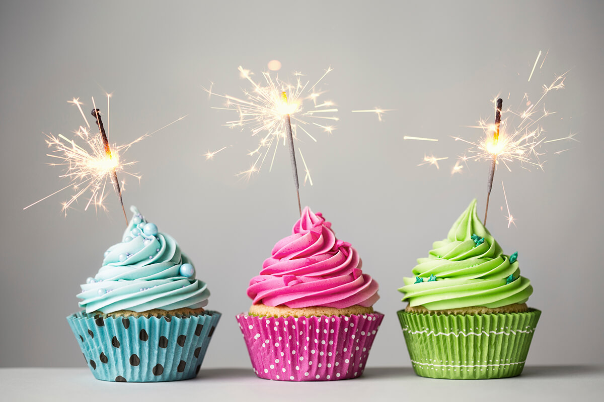 Row of three cupcakes with sparklers